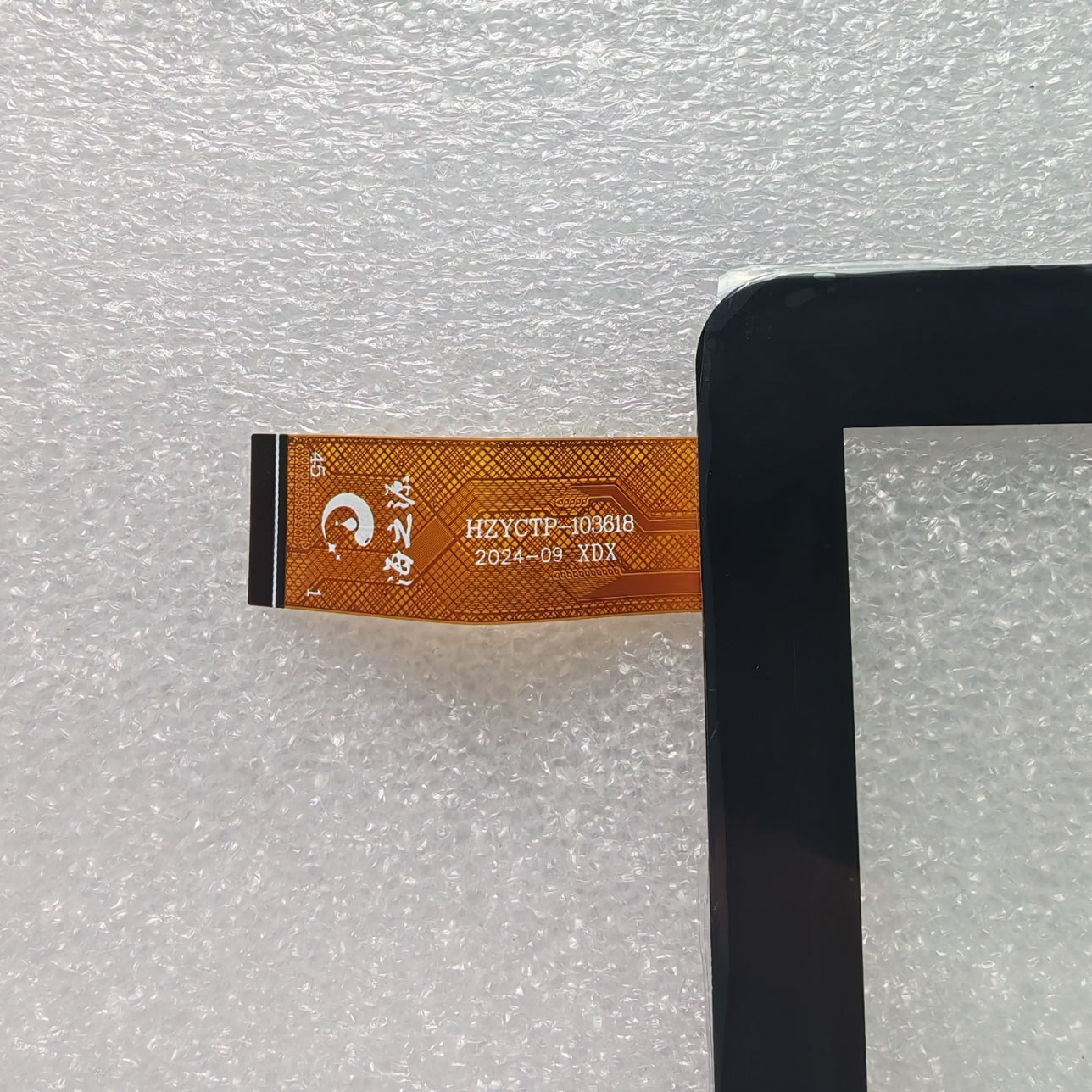 Close-up view of the internal flex cable showing the HZYCTP-103618 code to verify connector pins and hardware version