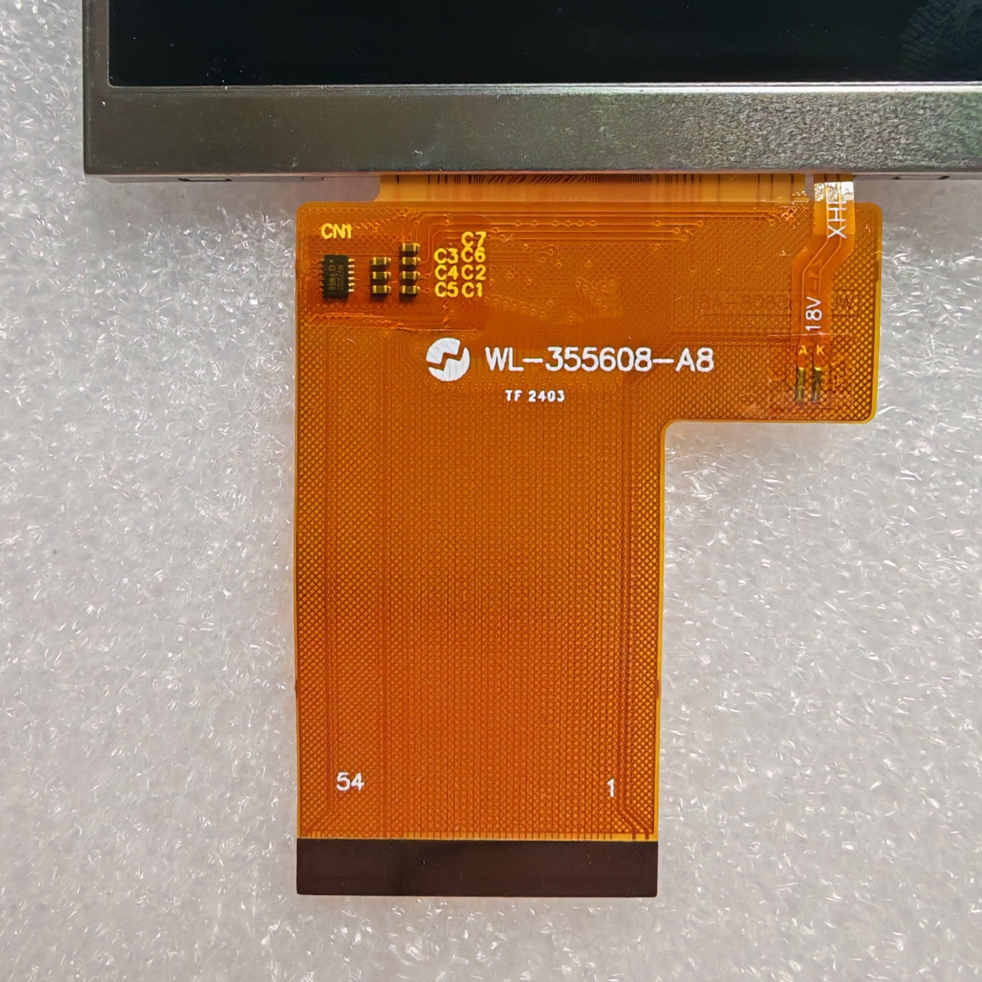 Close-up view of the internal ribbon cable for WL-355608-A8 to verify the connector pins and hardware code
